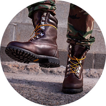 Man in camouflage pants Timberland Super Boots