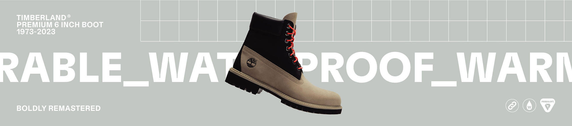 Image of a Timberland Premium 6 Inch Boot in a tan and black colorway with orange/red laces. Text behind the boot says Timberland Premium 6 Inch Boot 1973 - 2023. Additional text reads: 'Durable', 'Waterproof', 'Warm', 'Boldly Remastered'