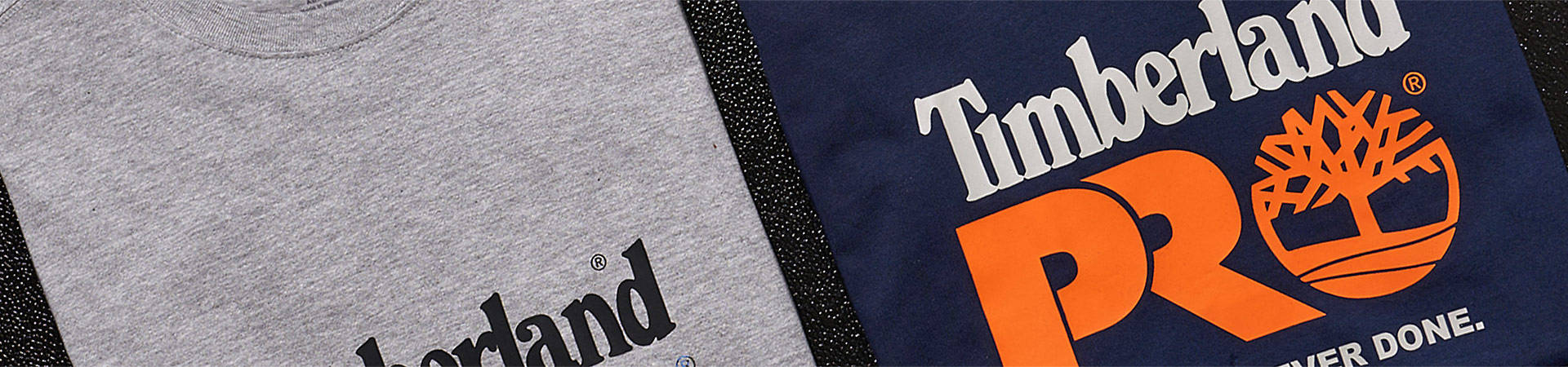 Image of t-shirts in gray, blue, brown and black with colorful Timberland PRO logos on the front