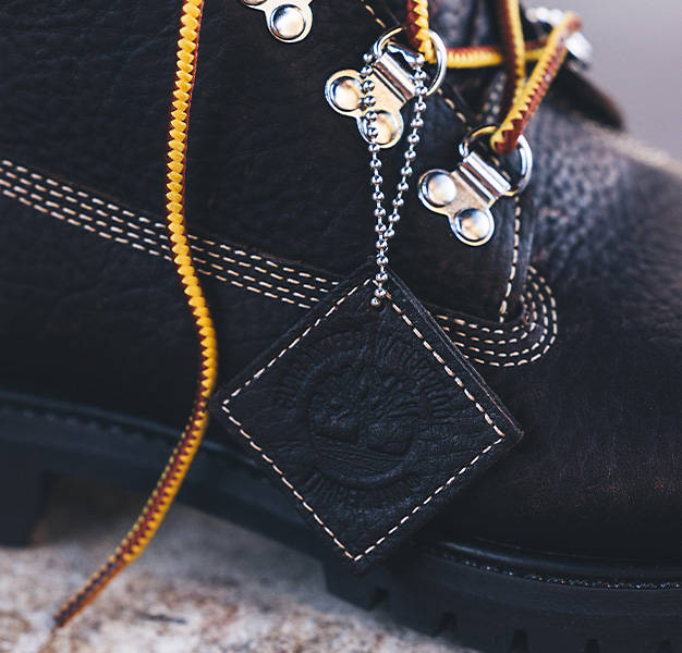 Close up image of the Timberland leather medallion attached to the right side of a Super Boot