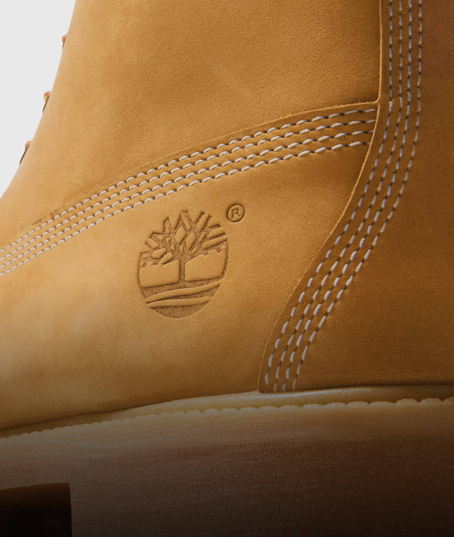 Close-up detail of the logo on a Timberland® yellow boot.