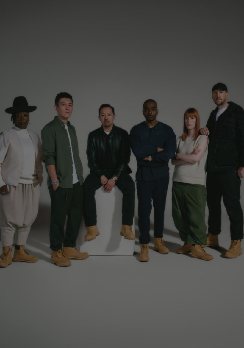 Nina Chanel Abney standing in a brown hat, white sweater with light tan vest, and tan pants; Edison Chen standing in a green button-down over a white t-shirt and gray pants; Humberto Leon seated on a tall white box, wearing a black leather jacket over a black ribbed v-neck sweater and white t-shirt with gray pants; , Dr. Samuel Ross standing in a blue sweater over a blue shirt with blue pants; Suzanne Oude Hengel standing ina cream-colored sleeveless sweater and green cargo pants; Christopher Raeburn standing in a black jacket over a white t-shirt with a black ball cap and black pants. All against a light gray background, wearing Timberland® yellow boots.