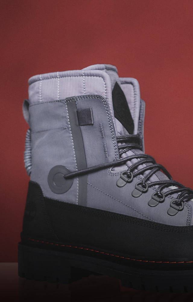 A gray and black boot designed by Christopher Raeburn