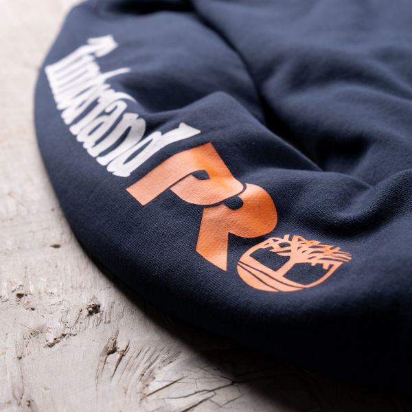 Close up of the Timberland PRO logo silk-screened on the right arm of the Men's Sam Adams x Timberland PRO Beerproof Hoodie. Swipe right to get to the next product in the image carousel.