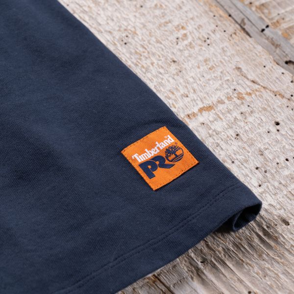 Close up of the Timberland PRO sewn on patch on the front, bottom-left area of the Men's Sam Adams x Timberland PRO Beerproof T-Shirt. Swipe right to get to the next product in the image carousel.