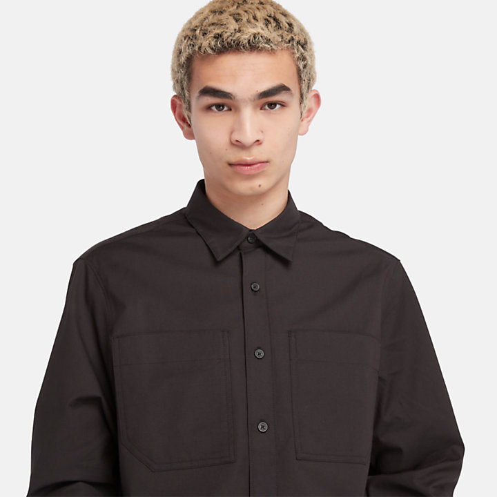 Camisa confeccionada con tecnología Outlast® para hombre en negro-