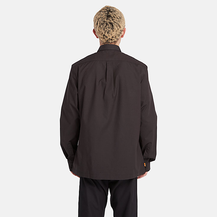 Camisa confeccionada con tecnología Outlast® para hombre en negro