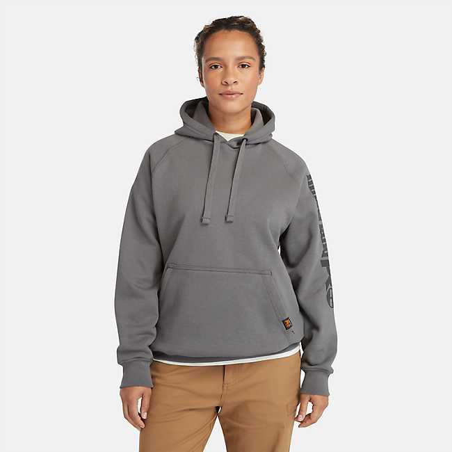 Premium Photo  A woman in a hoodie and sweatpants walking with
